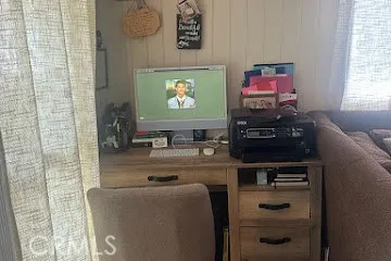 a kitchen with a table and chairs in it