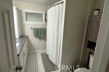 a bathroom with a toilet and a sink
