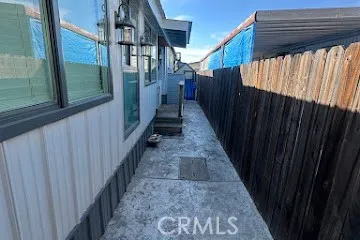 a view of a pathway of a house with wooden floor