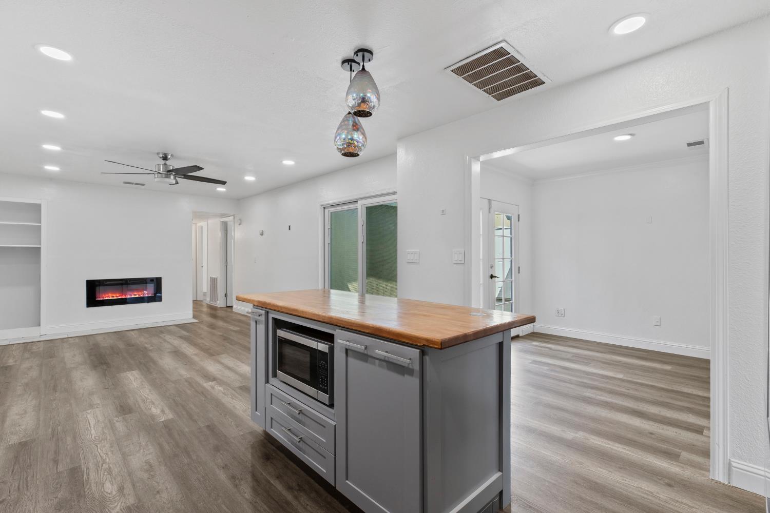 4005 Goldust Drive Modesto, CA 95355 - Photo 13 of 36 a kitchen with stainless steel appliances granite countertop a stove and a refrigerator