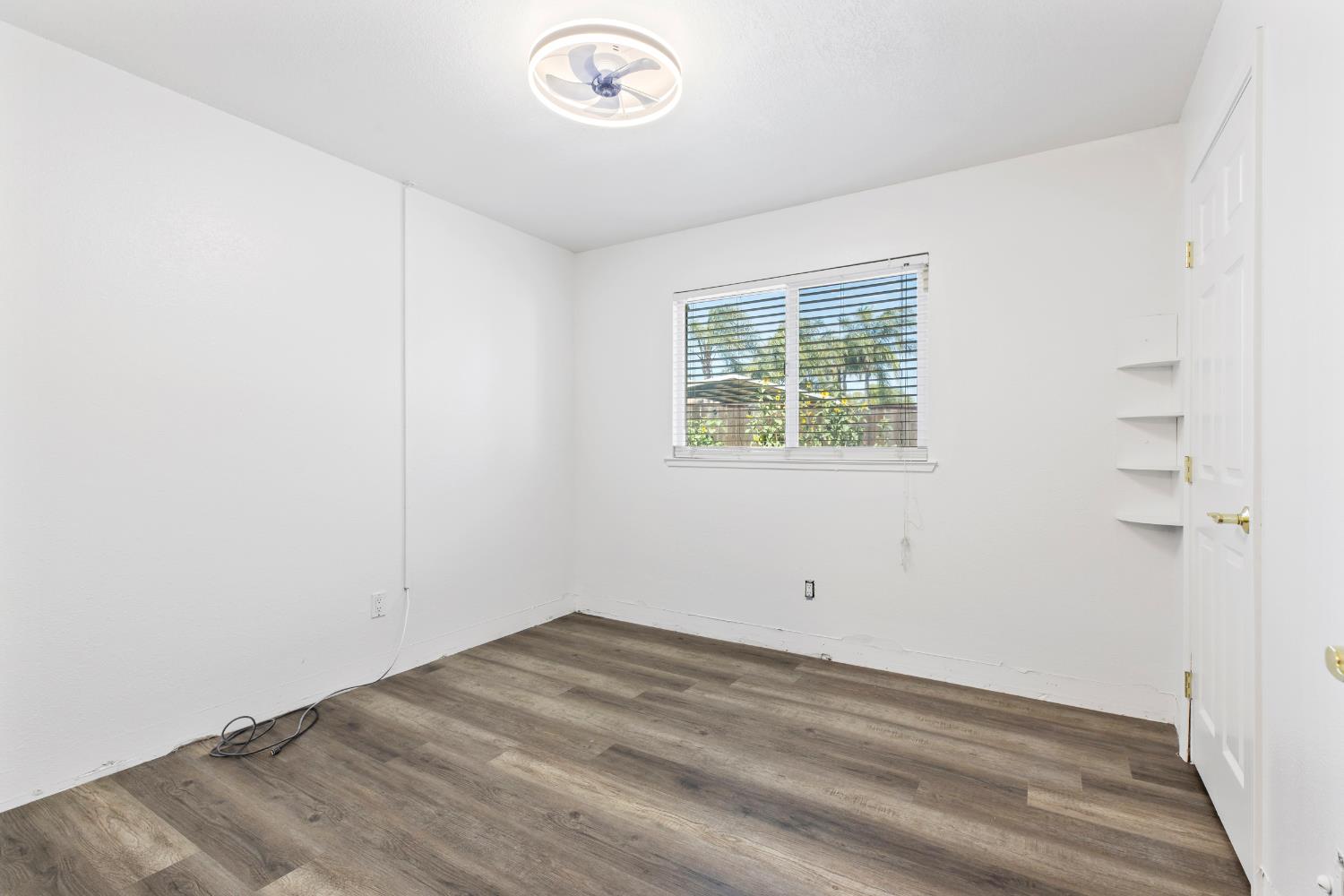 4005 Goldust Drive Modesto, CA 95355 - Photo 16 of 36 an empty room with a window
