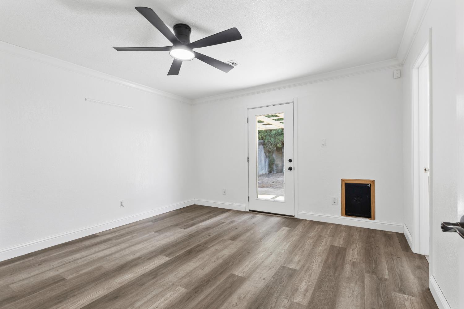 4005 Goldust Drive Modesto, CA 95355 - Photo 17 of 36 wooden floor in an empty room with a window