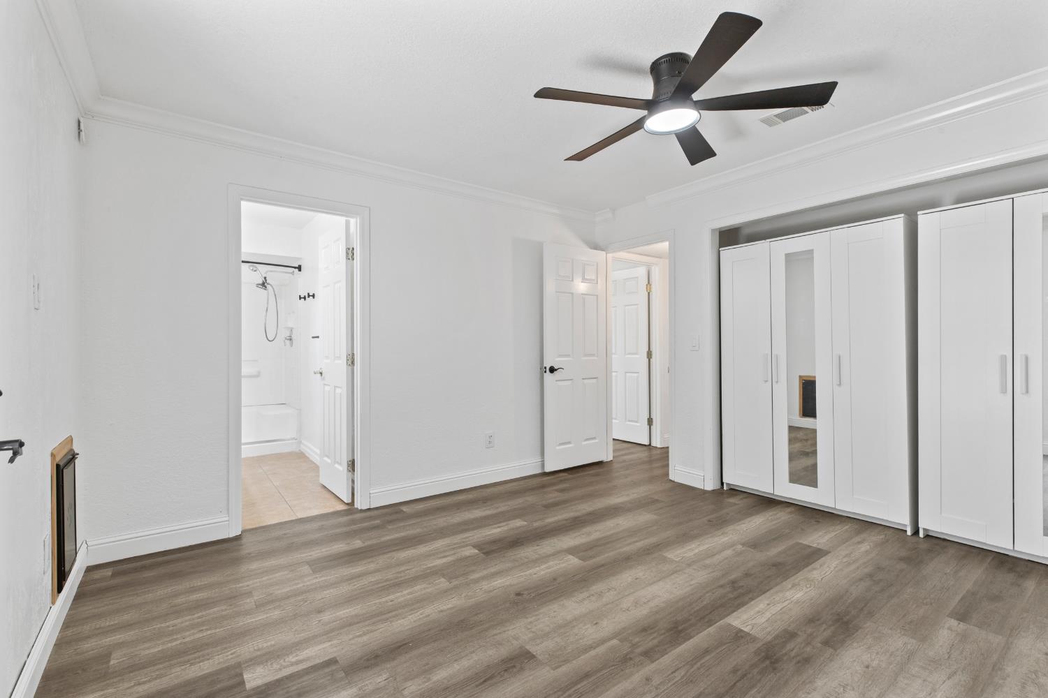 4005 Goldust Drive Modesto, CA 95355 - Photo 18 of 36 a view of empty room with wooden floor