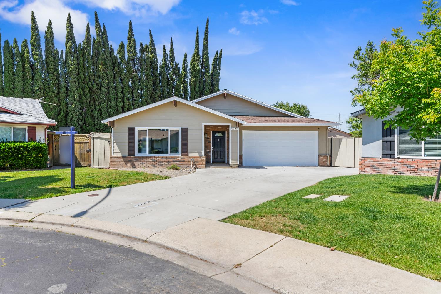 4005 Goldust Drive Modesto, CA 95355 - Photo 2 of 36 front view of a house with a yard