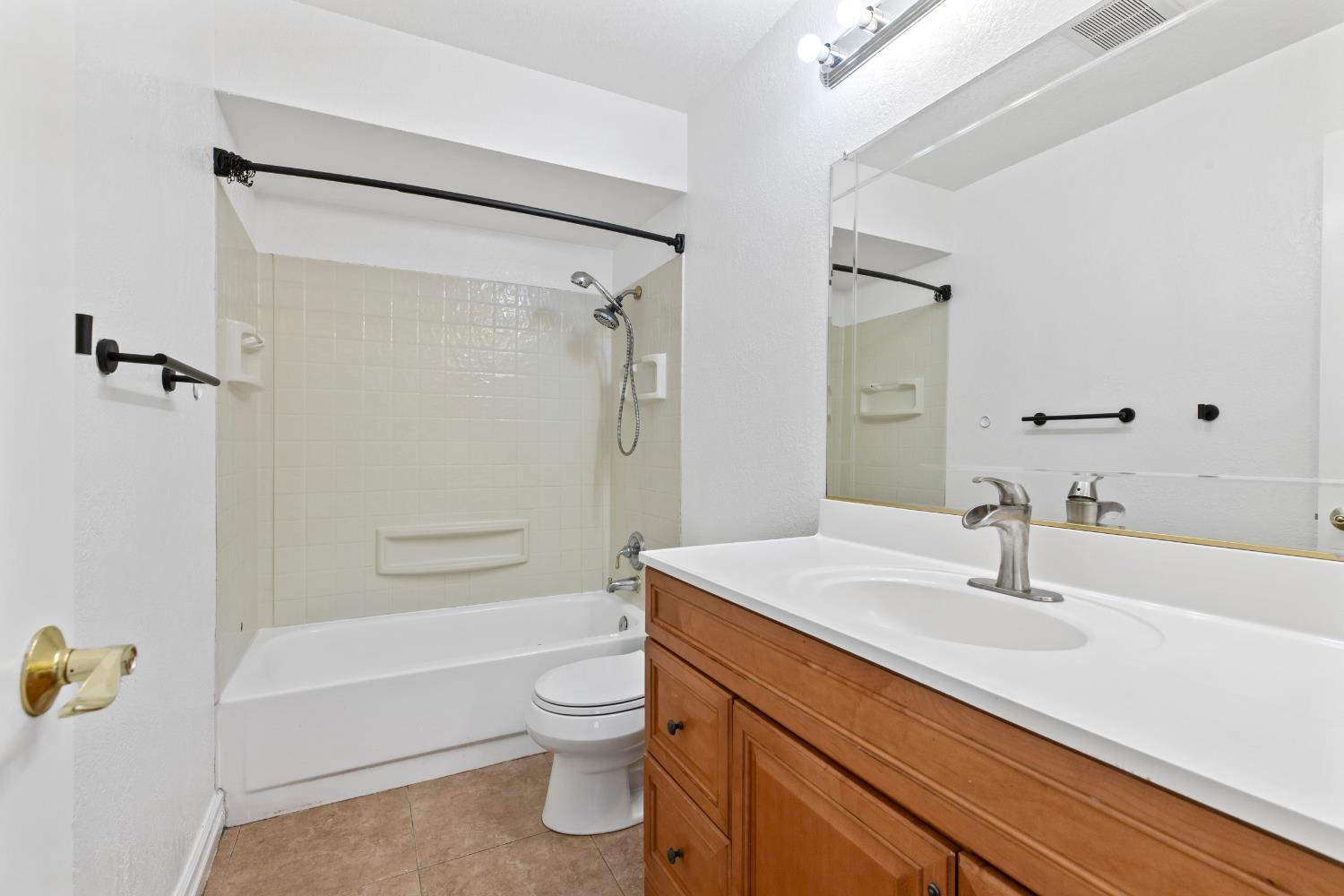4005 Goldust Drive Modesto, CA 95355 - Photo 23 of 36 a bathroom with a sink toilet and shower