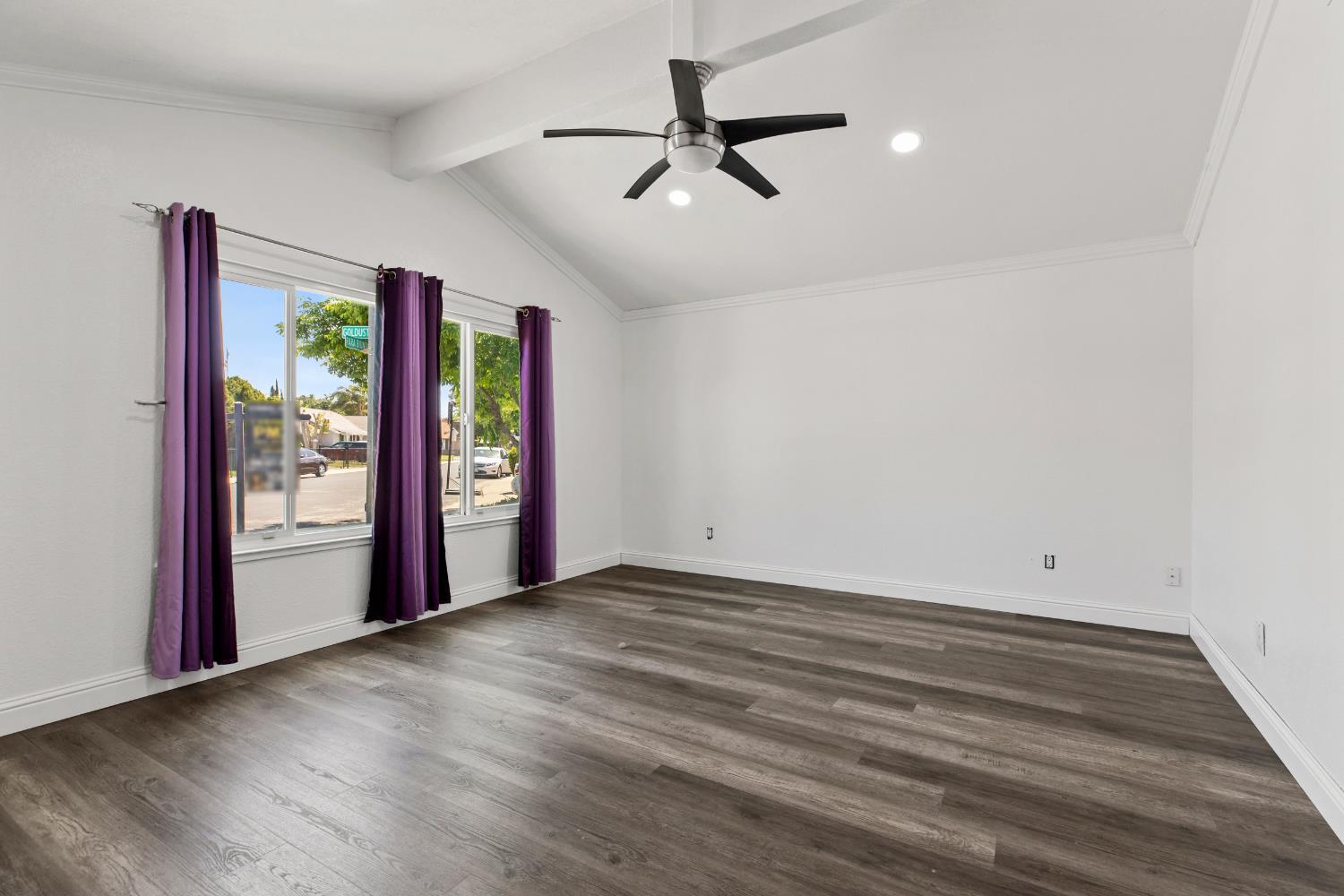 4005 Goldust Drive Modesto, CA 95355 - Photo 4 of 36 a view of an empty room with a window and a ceiling fan