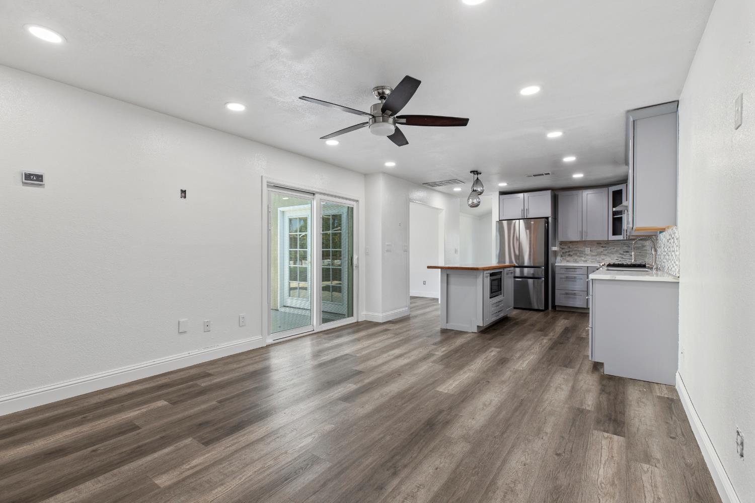 4005 Goldust Drive Modesto, CA 95355 - Photo 6 of 36 a view of a kitchen with a sink and wooden floor