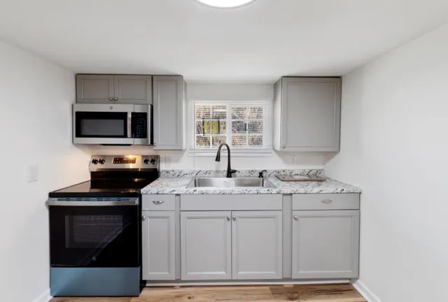 a view of a balcony with wooden fence and floor