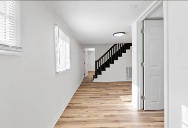 a view of room with window and hardwood floor