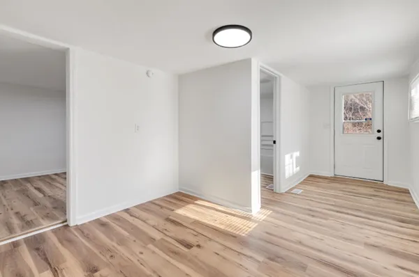 a view of room with window and hardwood floor