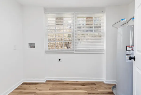 a view of a yard with snow on the road