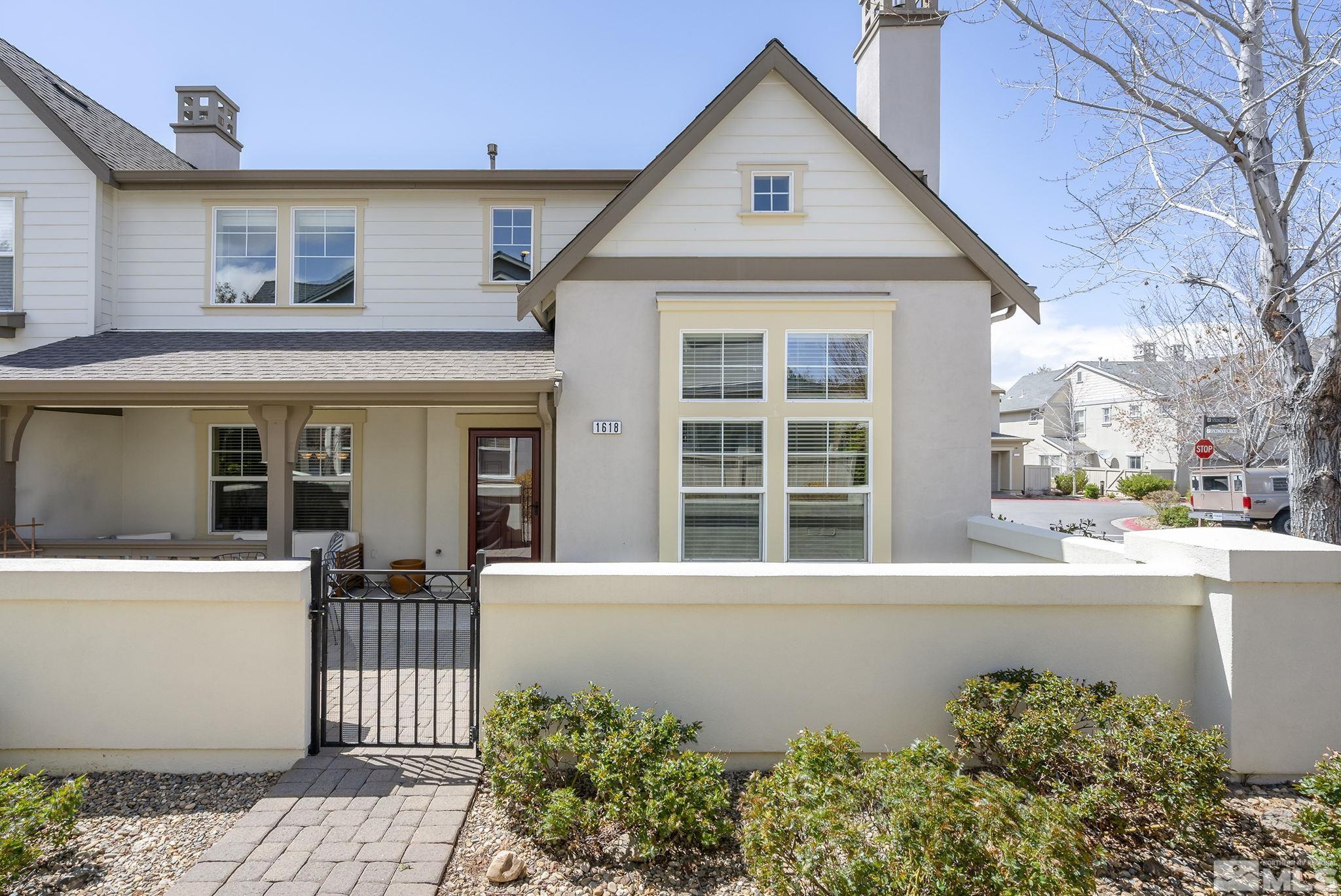 1618 Spring Hill Drive Reno, NV 89523 - Photo 1 of 25 a front view of a house with a garden