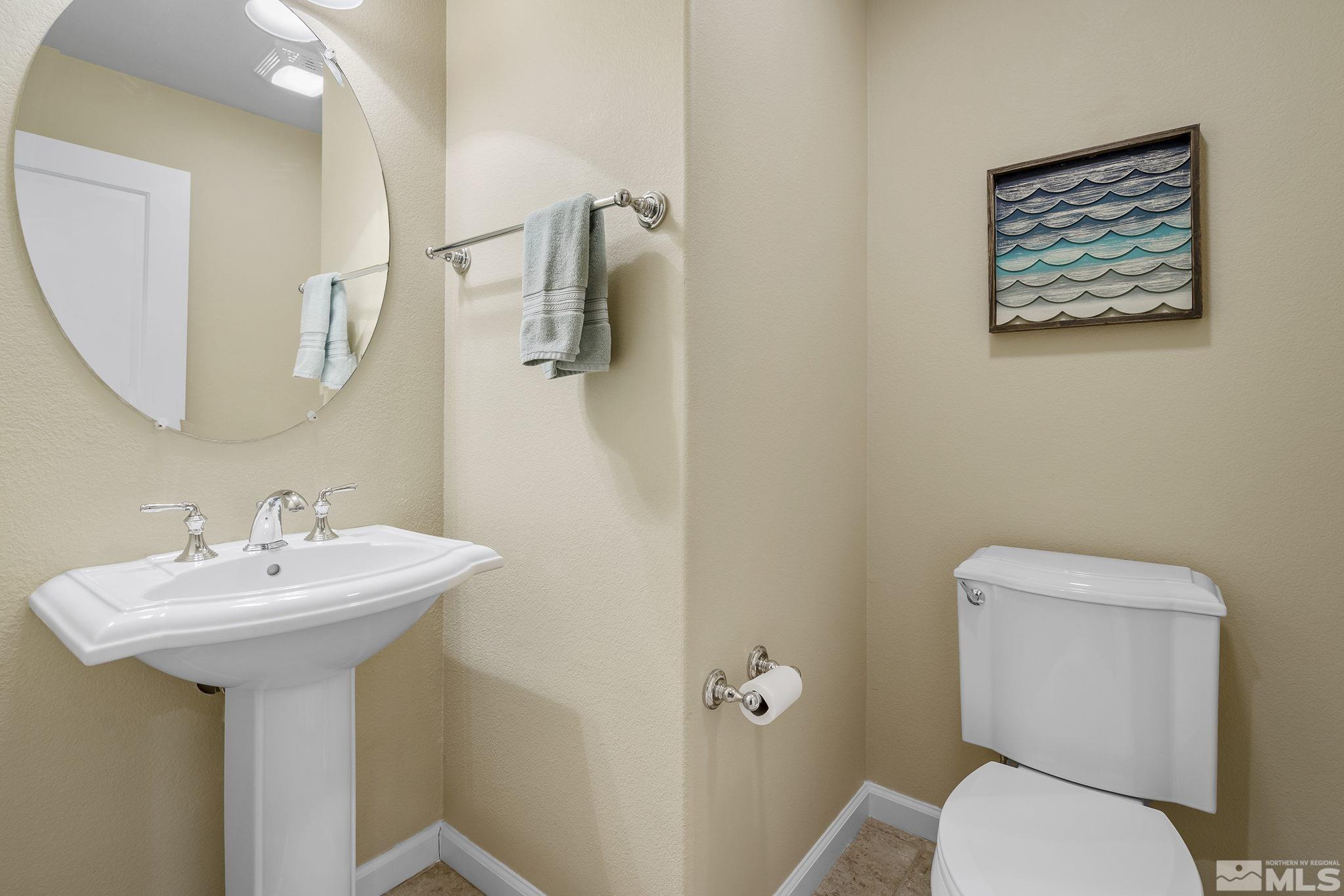 1618 Spring Hill Drive Reno, NV 89523 - Photo 17 of 25 a bathroom with a toilet sink and mirror
