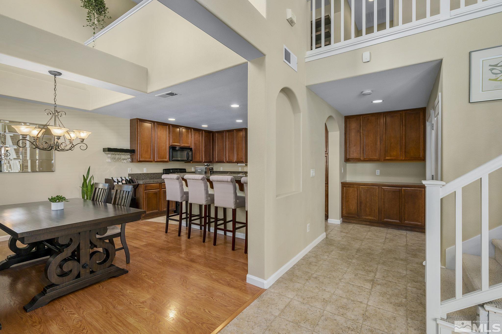 1618 Spring Hill Drive Reno, NV 89523 - Photo 4 of 25 a view of kitchen with kitchen island dining table and chairs