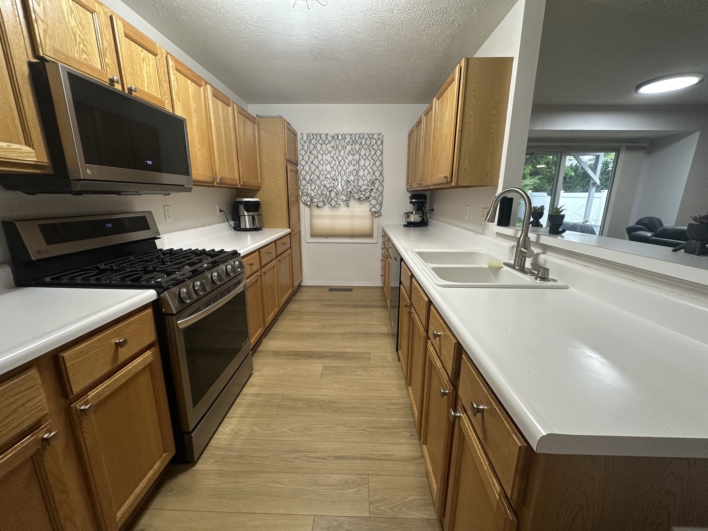 311 South Towanda Avenue, Unit 1 Normal, IL 61761 - Photo 6 of 19 a kitchen with stainless steel appliances granite countertop a sink stove and refrigerator