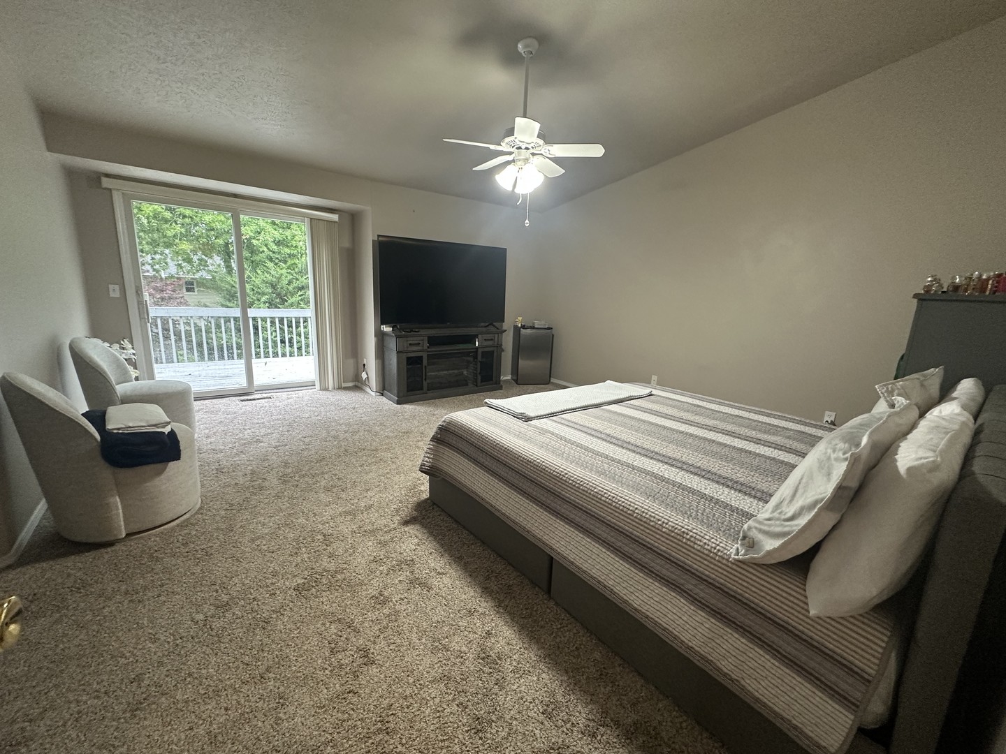 311 South Towanda Avenue, Unit 1 Normal, IL 61761 - Photo 10 of 19 a bedroom with a bed and a flat screen tv