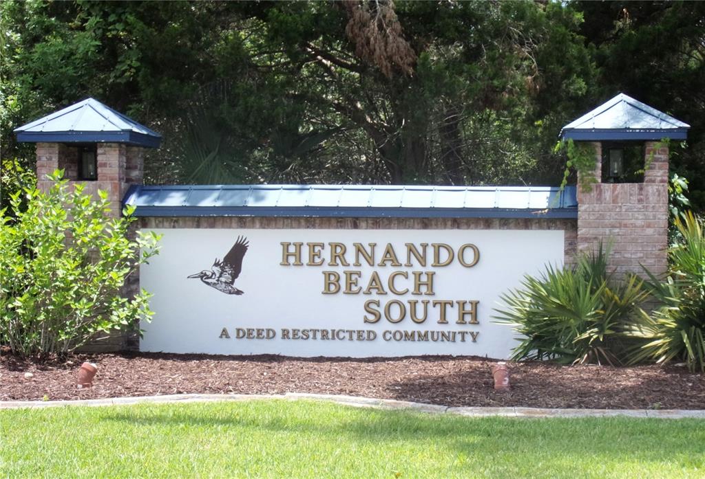 3406 Bluefish Drive Hernando Beach, FL 34607 - Photo 5 of 10 a sign that is sitting in front of a sign
