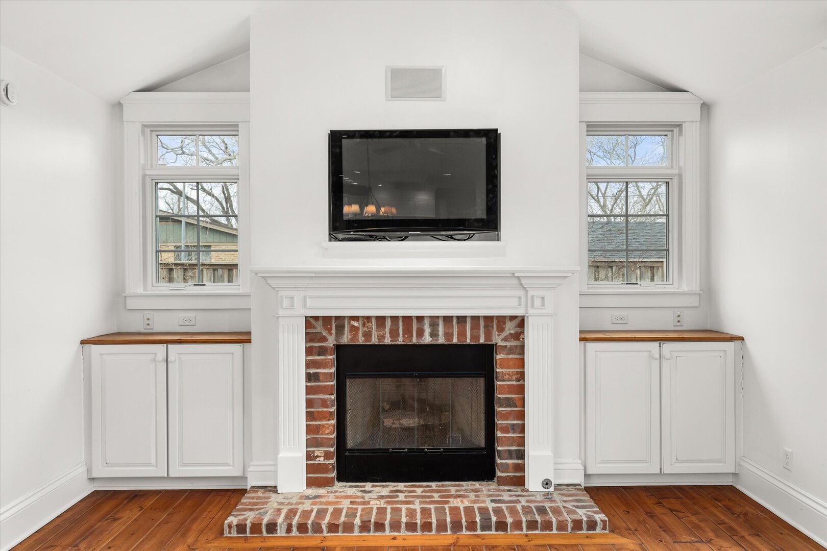 540 Pearl Street Ottawa, IL 61350 - Photo 23 of 70 a living room with a fireplace and a flat screen tv
