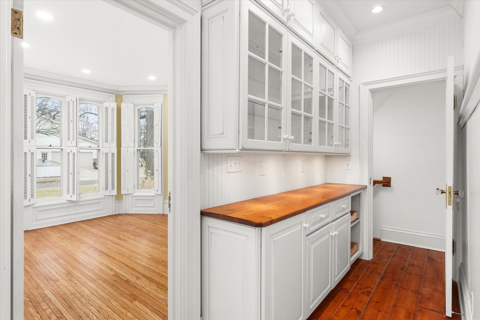 540 Pearl Street Ottawa, IL 61350 - Photo 29 of 70 a hallway with white cabinets and wooden floor