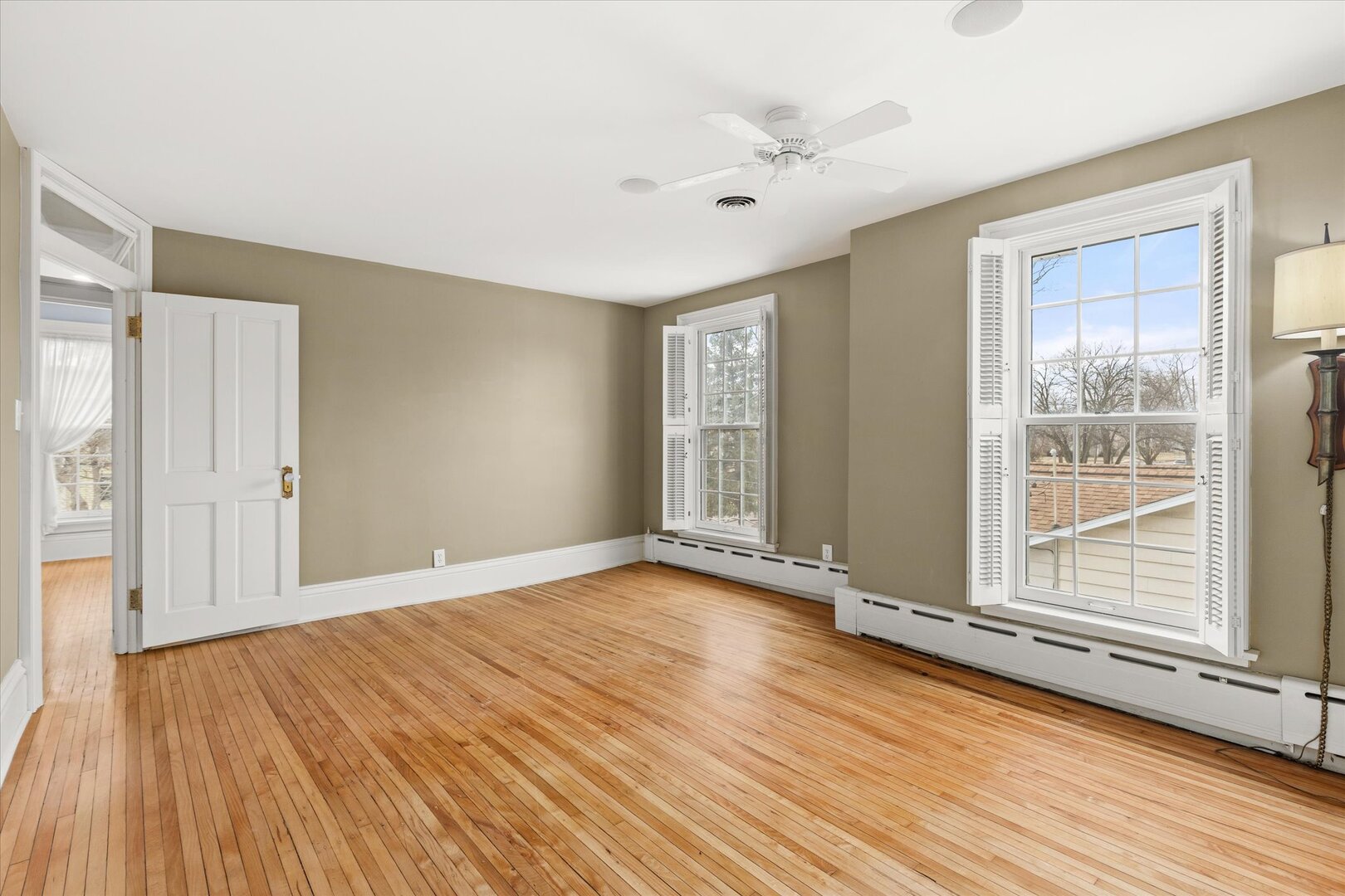 540 Pearl Street Ottawa, IL 61350 - Photo 41 of 70 a view of an empty room with wooden floor and a window