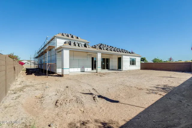 a view of a house with a snow in the yard