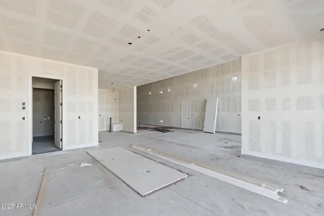 an empty room with a mirror