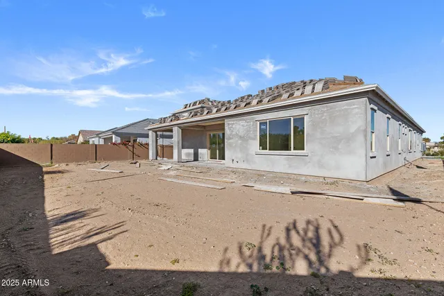 a view of a house with a snow on the road
