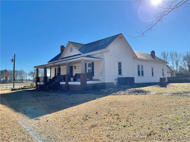 a living room with a couch and wooden floor