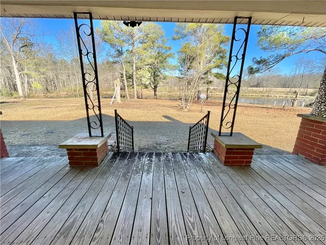 a spacious bedroom with a bed and a fireplace