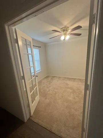 a view of empty room with windows