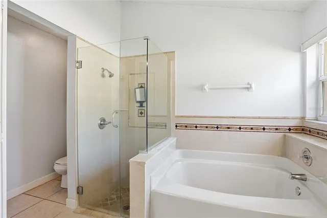 a bathroom with a sink a mirror and a shower