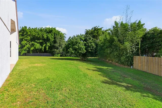 a view of grassy field with benches