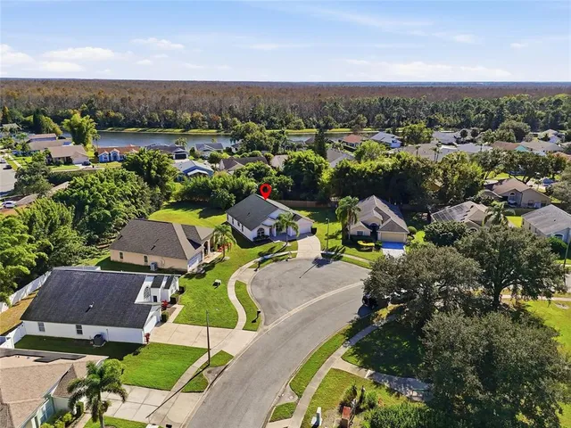 an aerial view of a house with a garden