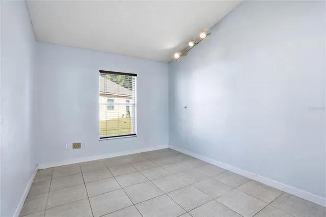 a kitchen with a sink a stove and cabinets