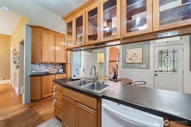 a kitchen with a sink and cabinets