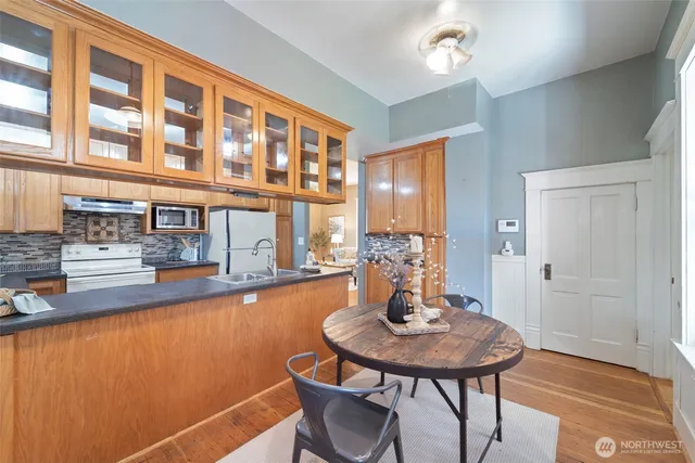 a view of a dining room with furniture and window