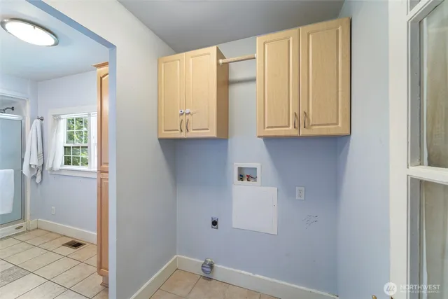 a view of cabinets and utility room