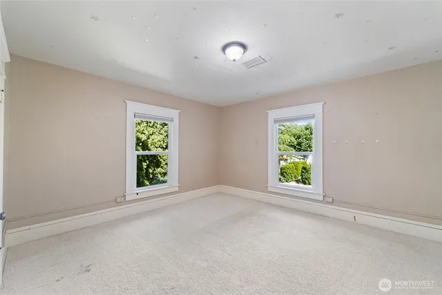 an empty room with windows