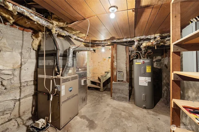 a utility room with lots of wooden furniture