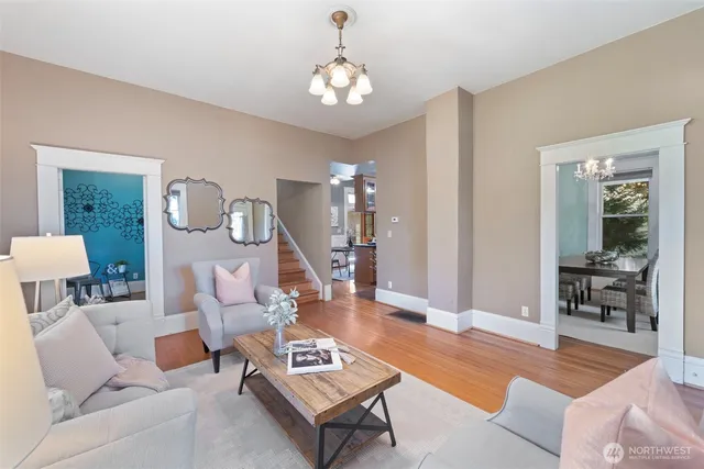 a living room with furniture a table and decor