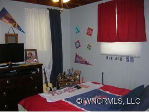 677 Big Island Road Forest City, NC 28043 - Photo 14 of 24 a bathroom with a sink vanity and a mirror