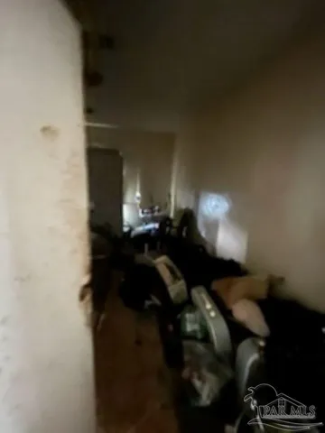 a living room with furniture and a lamp