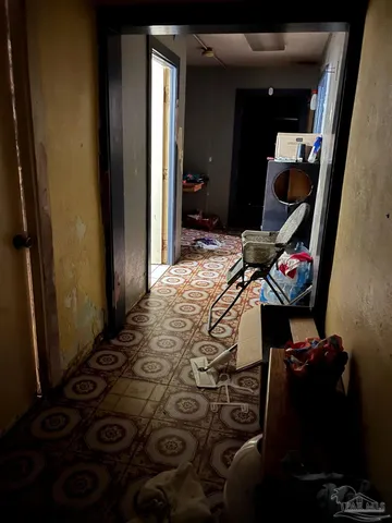 a living room with furniture and flat screen tv