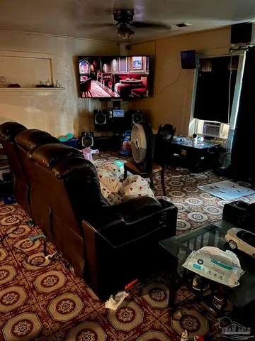 a room with furniture and a flat screen tv