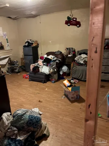 a bedroom with a bed and a mirror