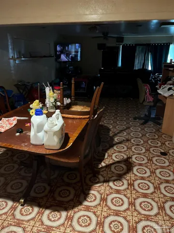 a room with furniture and a flat screen tv