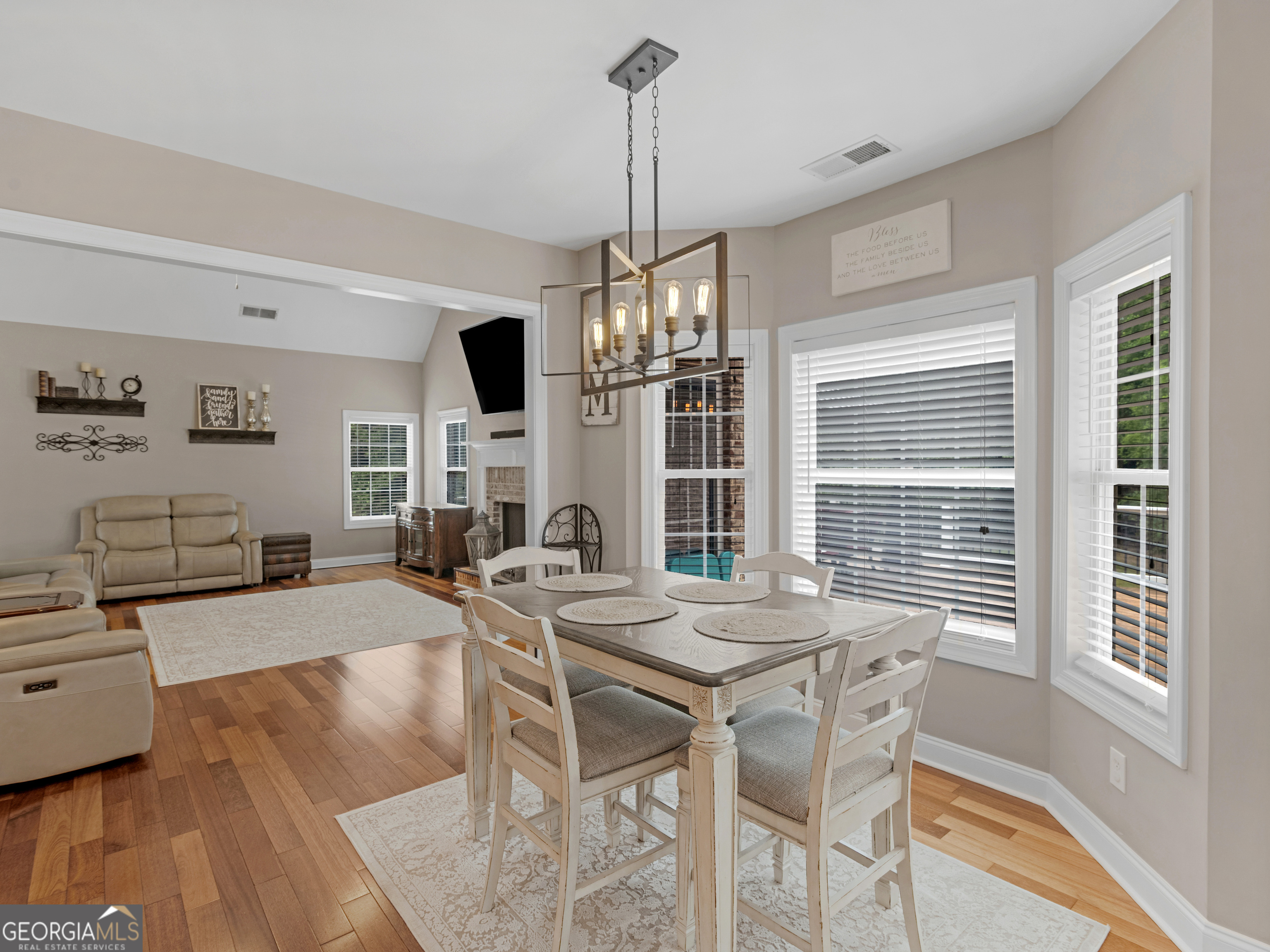 221 Hummingbird Court Hampton, GA 30228 - Photo 29 of 77 a view of a dining room with furniture window and wooden floor
