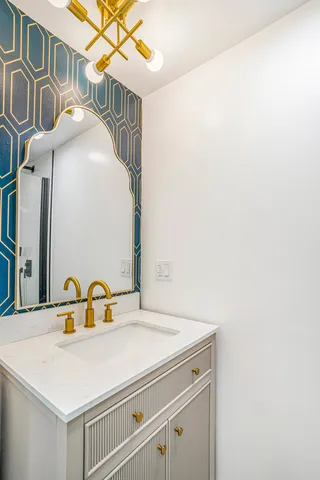 a bathroom with a sink and a mirror