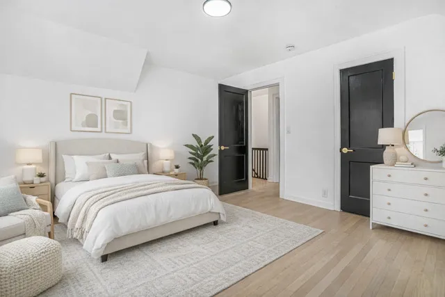 a bedroom with a bed and a dresser