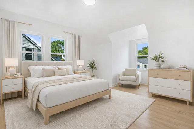 a bedroom with a bed and a couch